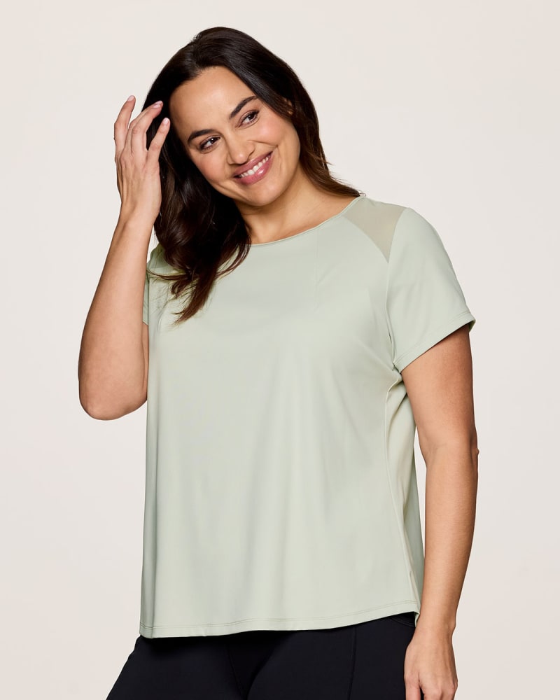 Front of a model wearing a size 1X Plus On The Run Tee in Green Tea by RBX Active. | dia_product_style_image_id:347931